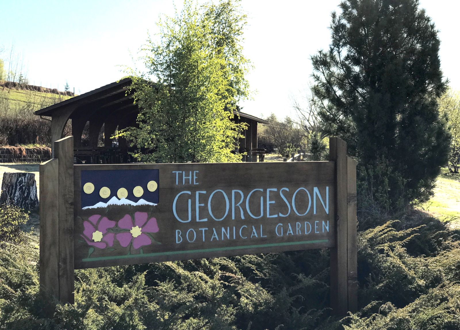 A wooden sign for the Georgeson Botanical Garden.